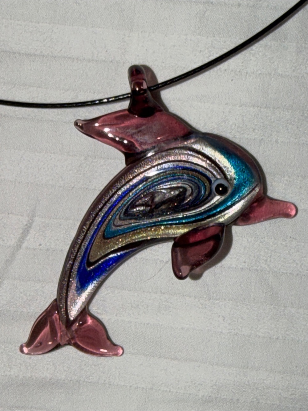Blown glass dolphin pendant on neckwire